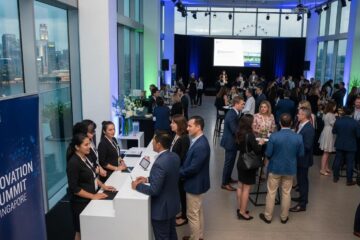 Corporate event in Singapore with attendees networking and engaging in discussions